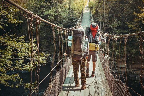 travelers-crossing-through-hanging-bridge.jpg